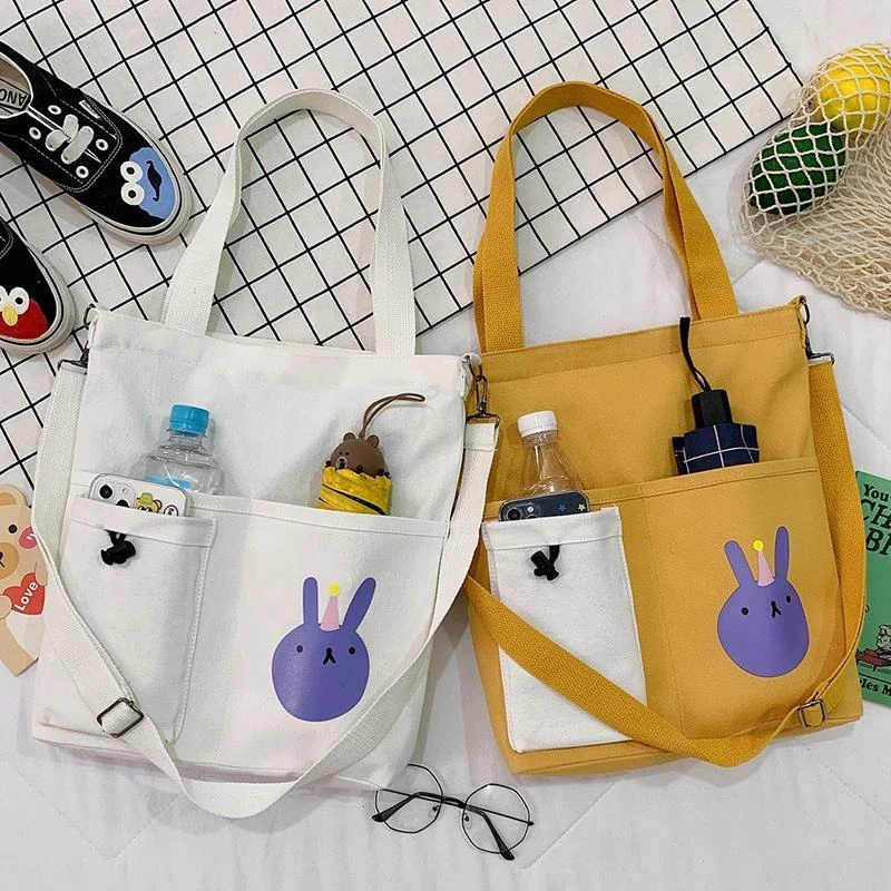 Canvas Student Tote with Rabbit Graphic and Front Pockets product reference image