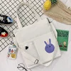 Canvas Student Tote with Rabbit Graphic and Front Pockets White color SKU reference