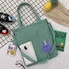 Canvas Student Tote with Rabbit Graphic and Front Pockets Light green color SKU reference