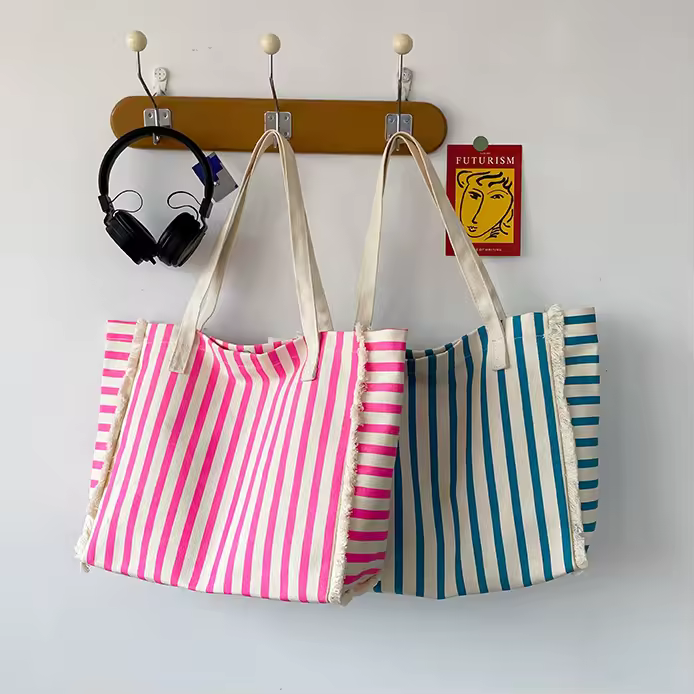 Striped Canvas Tote Bag with Raw-Edge Trim and Decorative Chain Detail product reference image