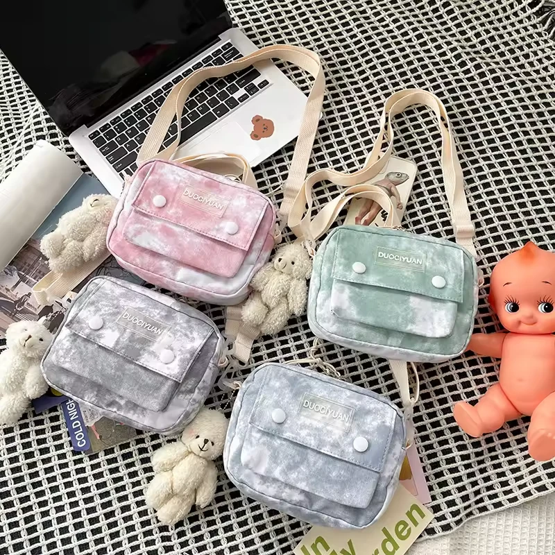 Tie-Dye Mini Crossbody Bag with Plush Bear Charm product reference image