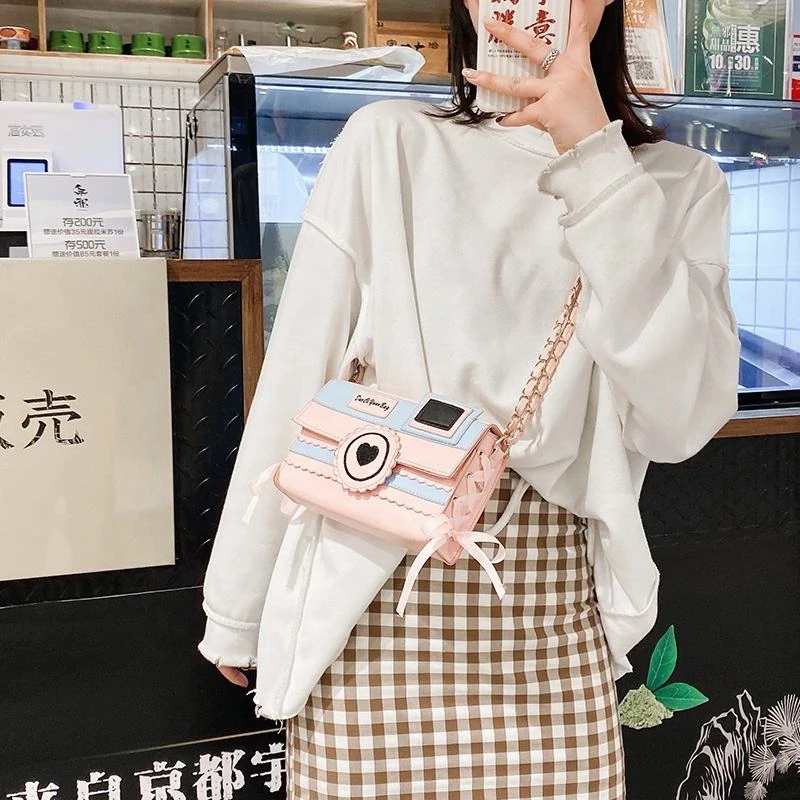 Wavy Camera-Shaped Glossy Purse with Bow Detail product reference image
