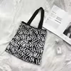 Woven Plaid Shoulder Tote with Mixed Pattern Options Letter pattern handle style reference