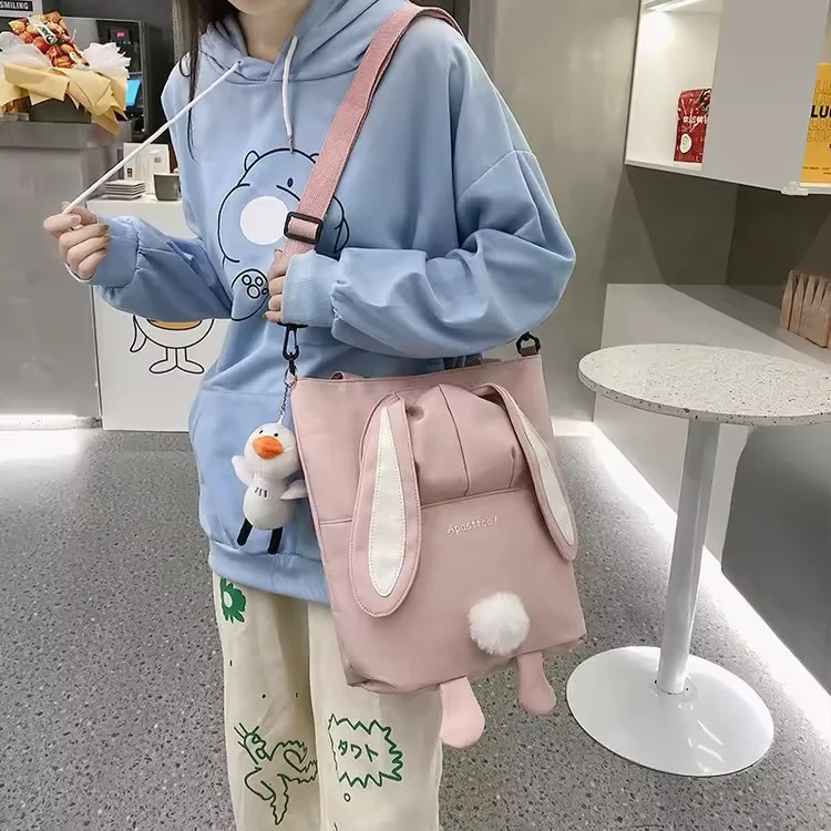 Rabbit-Ear Polyester Shoulder Bag with Pom-Pom Detail product reference image