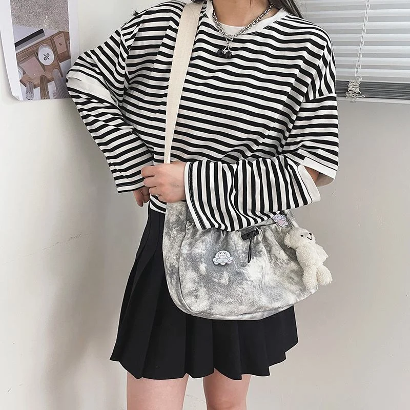 Patterned Drawstring Shoulder Bag with Bunny Charm product reference image