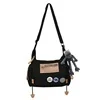 Canvas Letter-Print Messenger Bag with Plush Pendant Black color SKU reference