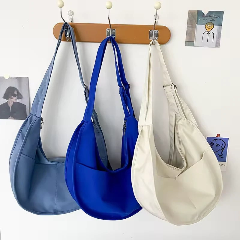 Dumpling-Shape Crossbody Bag with Adjustable Strap product reference image
