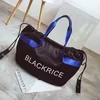 Nylon Color-Block Drawstring Travel Duffel with Soft Handles Black color SKU reference