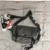 Oxford Utility Crossbody Bag with Detachable Charm Grey color SKU reference