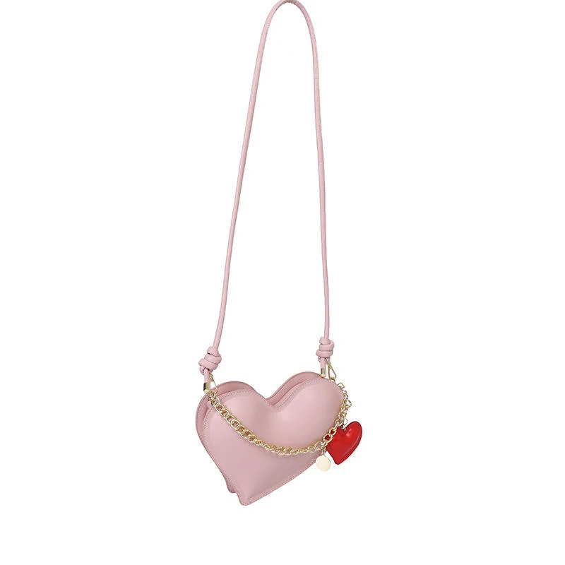 Heart-Shaped PU Crossbody Bag with Pendant Detail Pink color SKU reference