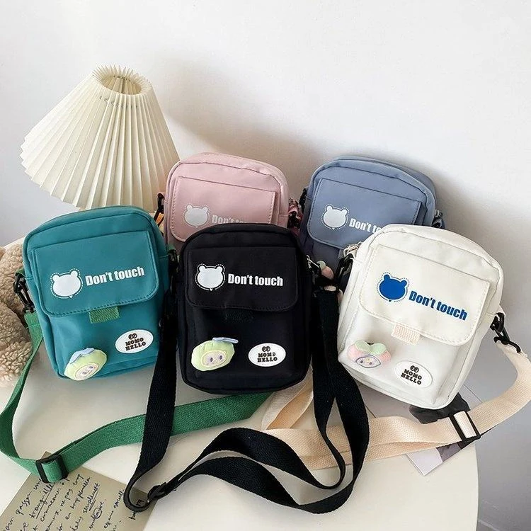 Mini Nylon Crossbody Bag with Bear Pendant & Adjustable Strap product reference image