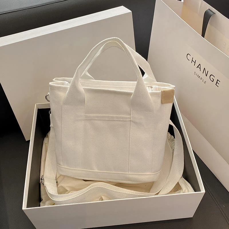 Compact Canvas Crossbody Bag with Multi-Pocket Storage product reference image