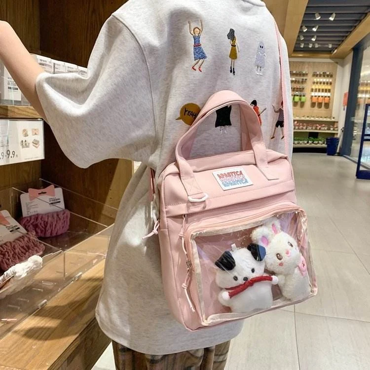 Nylon Crossbody Bag with Transparent Window and Doll Charms Pink color SKU reference