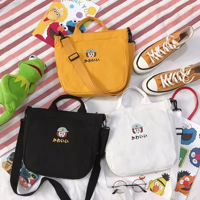 Cotton Messenger Tote with Embroidered Character Details product reference image