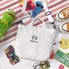 Cotton Messenger Tote with Embroidered Character Details White color SKU reference