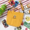 Cotton Messenger Tote with Embroidered Character Details Yellow color SKU reference